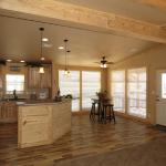 Mallard's Landing Lodge floor to ceiling windows in dining area and bar island in kitchen
