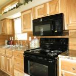 Honeysuckle Kitchen with Hickory Cabinets at Recreational Resort Cottages and Cabins 