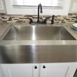 Kitchen Stainless Steel Farmhouse Sink in the Platinum Model P-528SL presented by Recreational Resort Cottages and Cabins located in Rockwall, Texas. cabinsupercenter.com