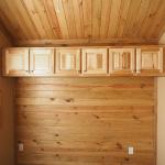 Hill Country Bedroom above bed cabinets at Recreational Resort Cottages and Cabins in Rockwall, Texas