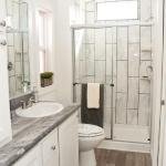 Platinum Premier Tiny House with a tile walkin shower by Recreational Resort Cottages and Cabins in Rockwall, Texas