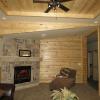 Creek Lodge Cabin Living Area with Full Pine Feature Wall on display at Recreational Resort Cottages in Rockwall, Texas